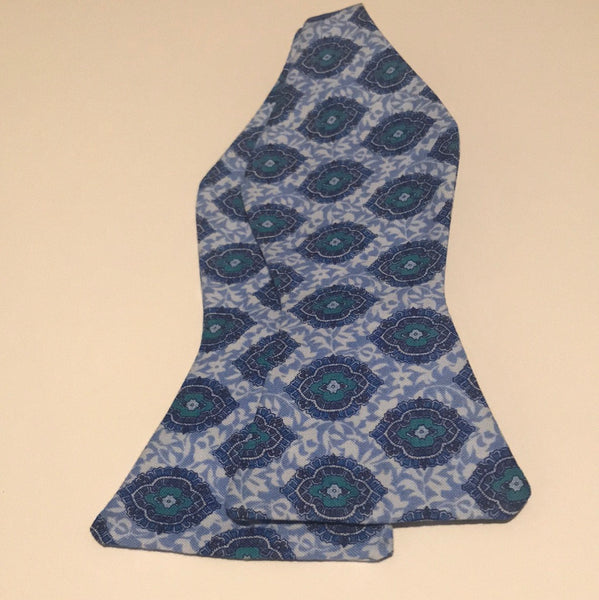 Light blue print with hints of green and dark blue Bowtie set